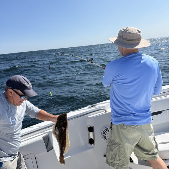 Hooked up, fluke coming aboard